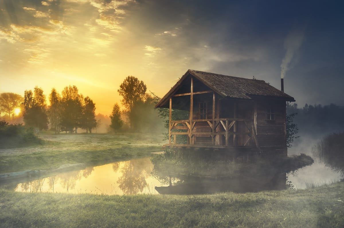 Creepy cabin in the woods near a stream with smoke coming from chimney